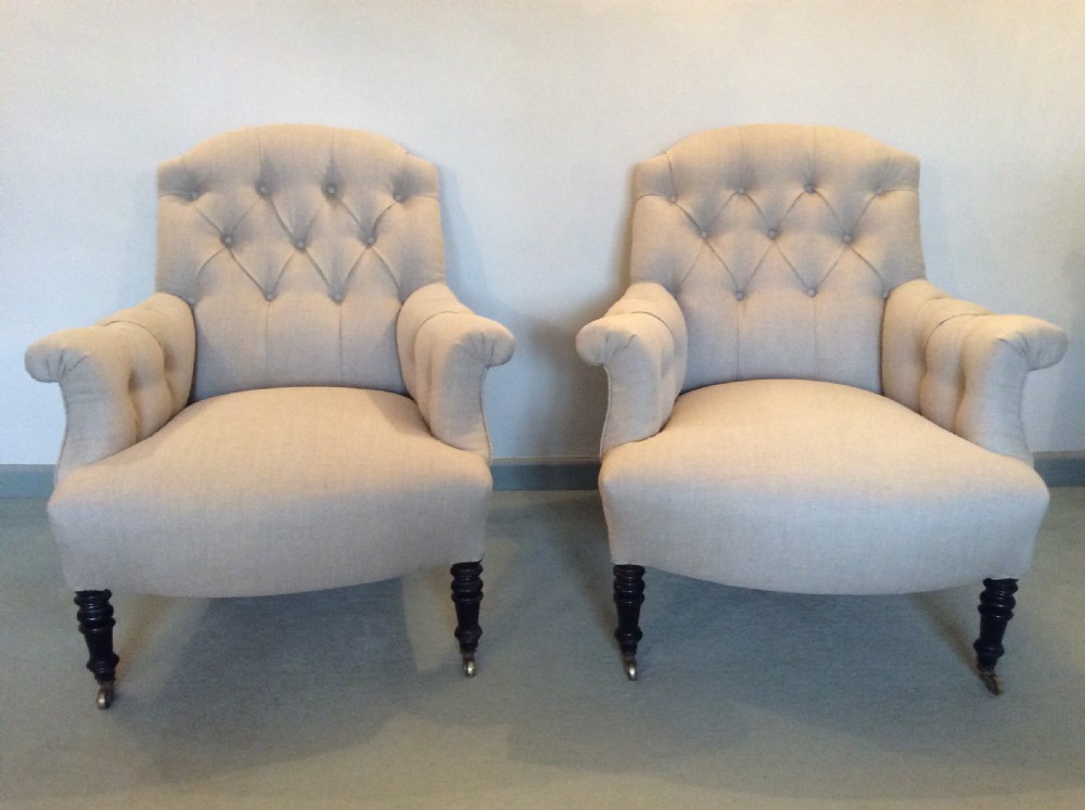 A PAIR of buttoned Fench upholstered armchairs