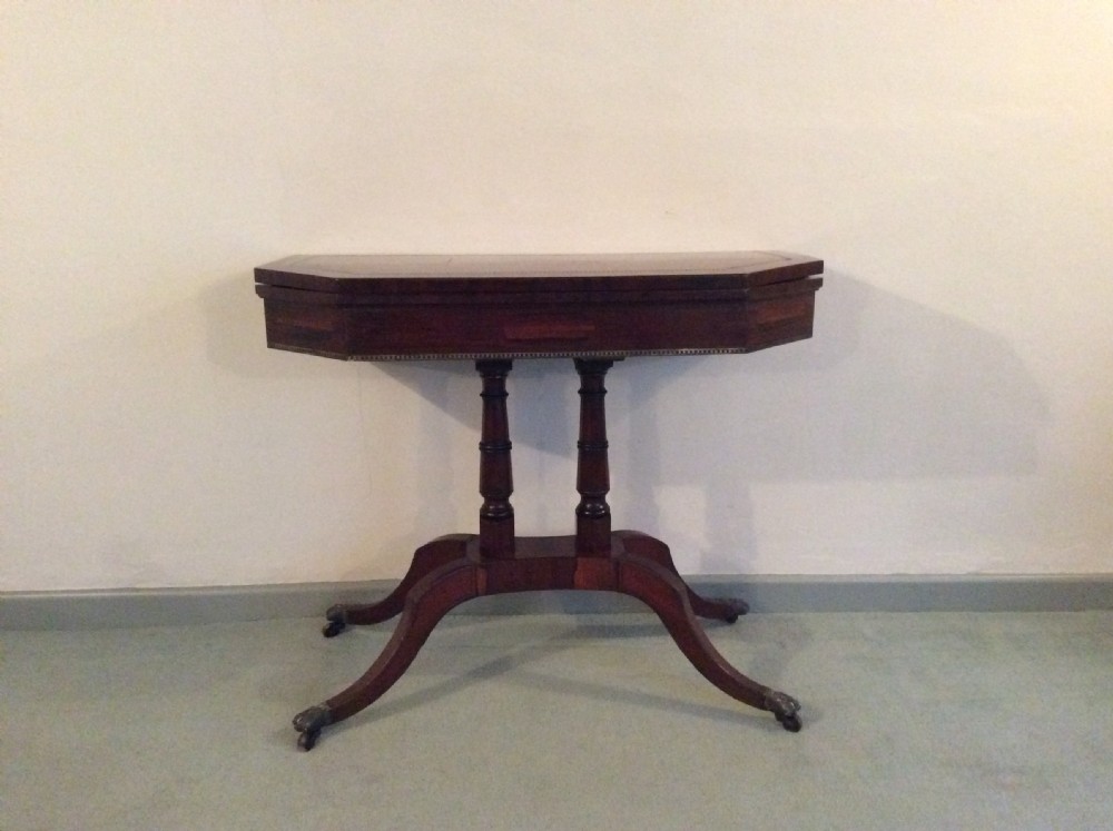 A Regency rosewood brass inlaid hall table