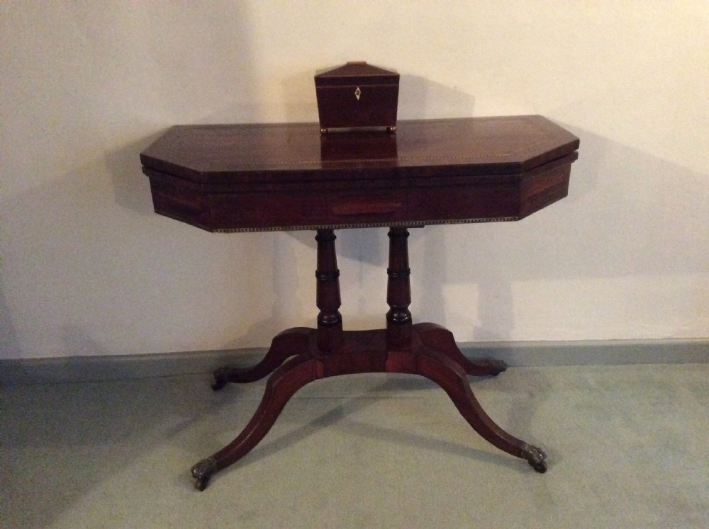 A Regency rosewood brass inlaid hall table View II