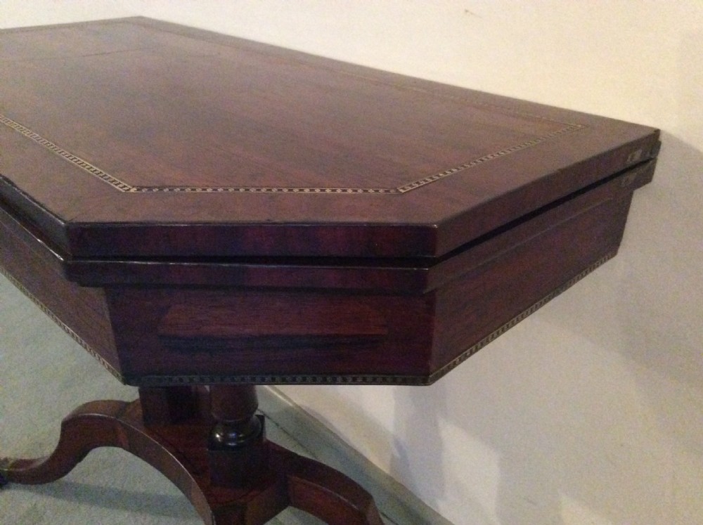 A Regency rosewood brass inlaid hall table View VI