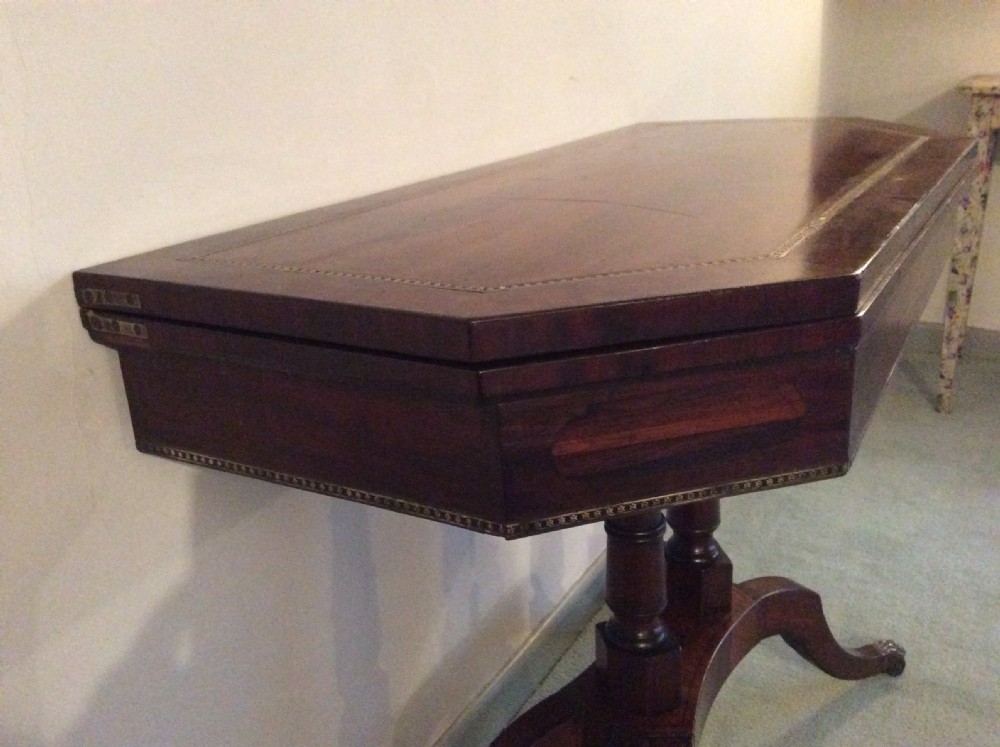 A Regency rosewood brass inlaid hall table View VII