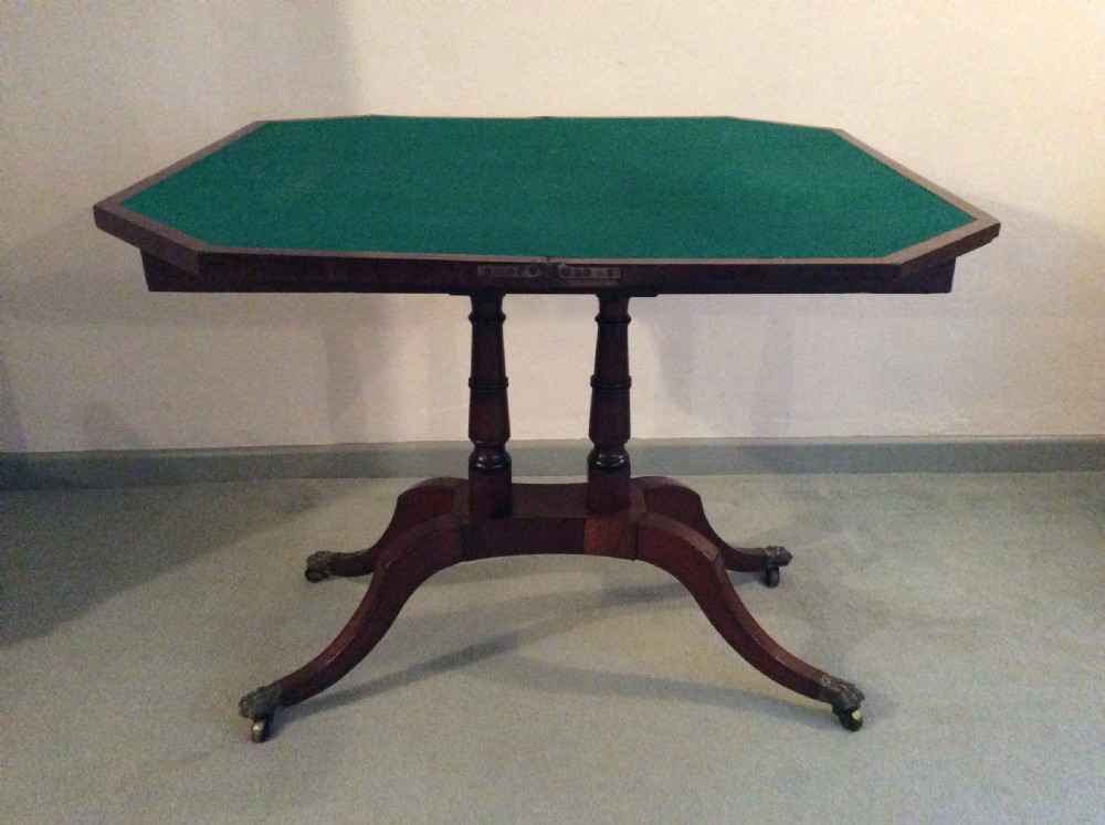 A Regency rosewood brass inlaid hall table View X