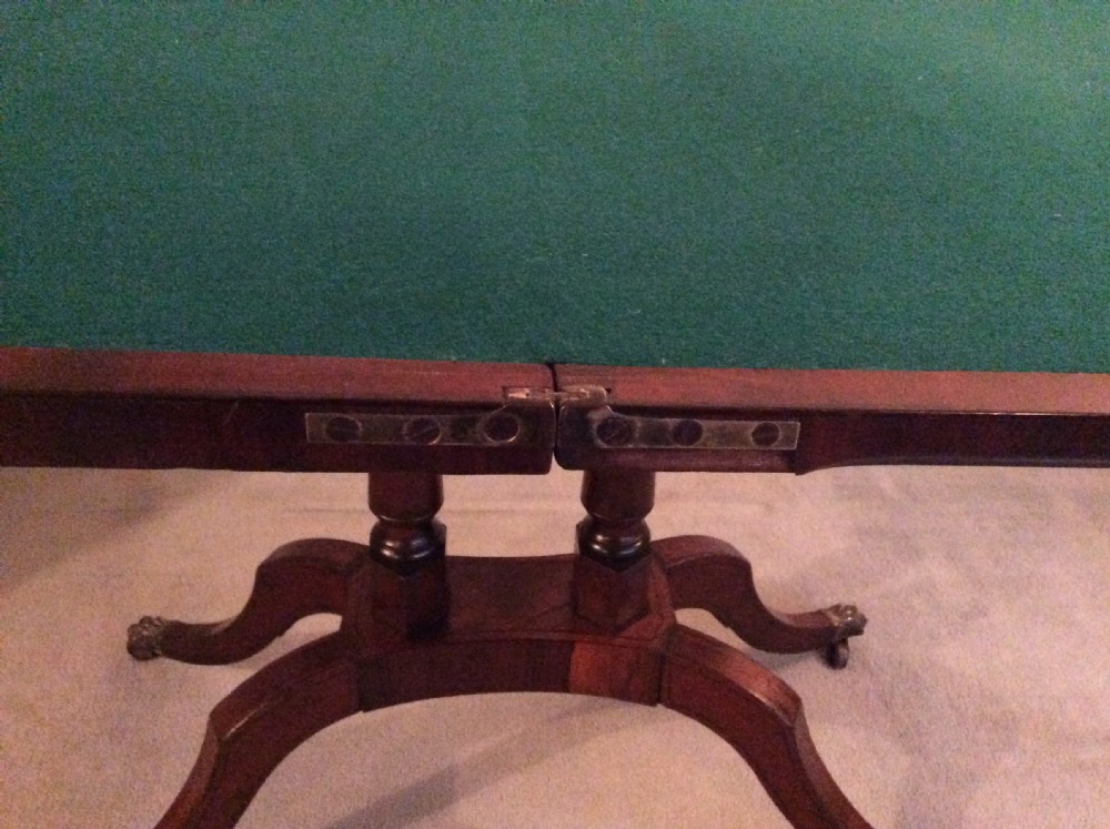 A Regency rosewood brass inlaid hall table View XI