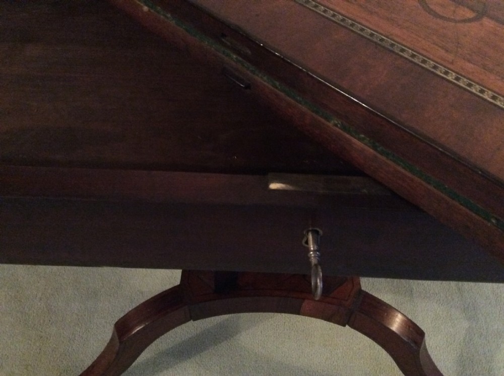 A Regency rosewood brass inlaid hall table View XII