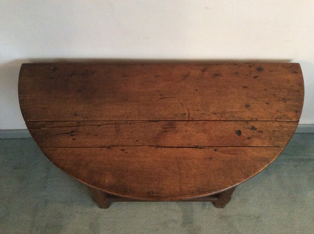 An 18thC French oak low occasional table View V