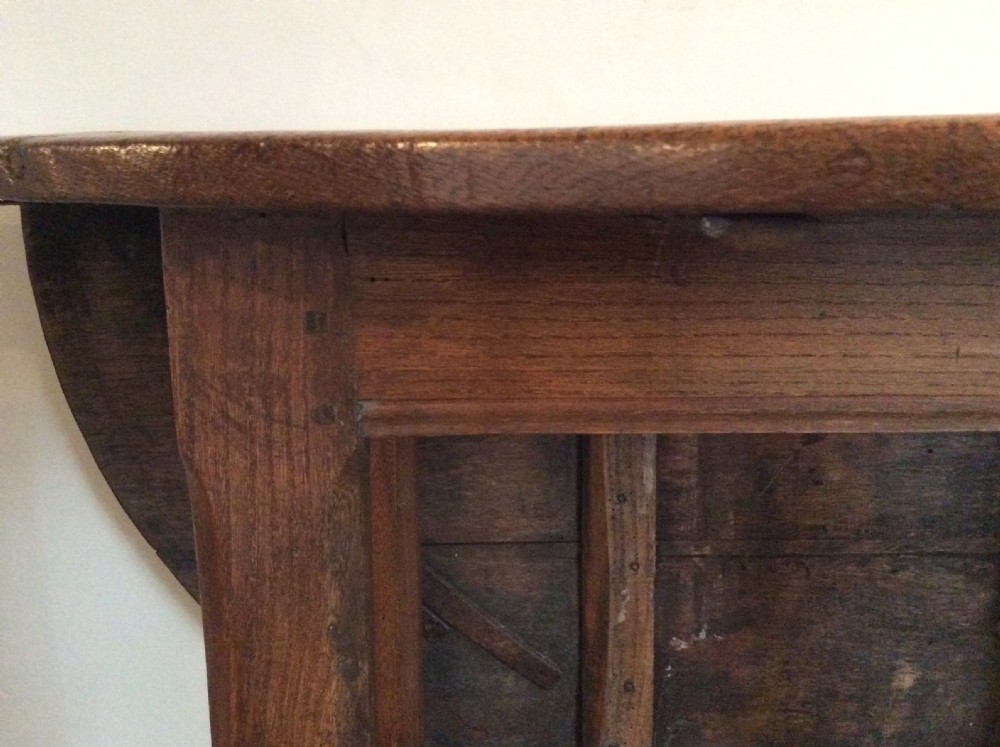 An 18thC French oak low occasional table View VII