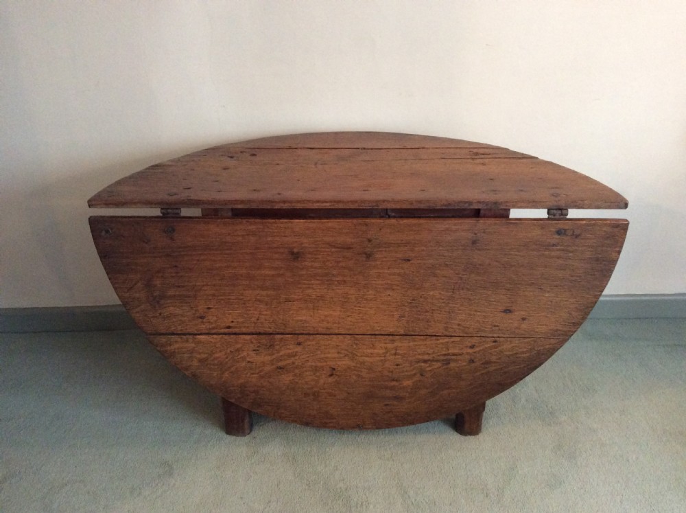 An 18thC French oak low occasional table View XI