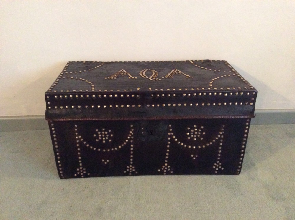 An 18thC leather studded trunk