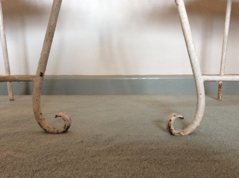 A pair of French iron garden chairs View II