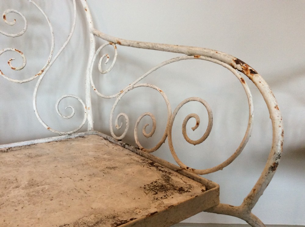 A pair of French iron garden chairs View III