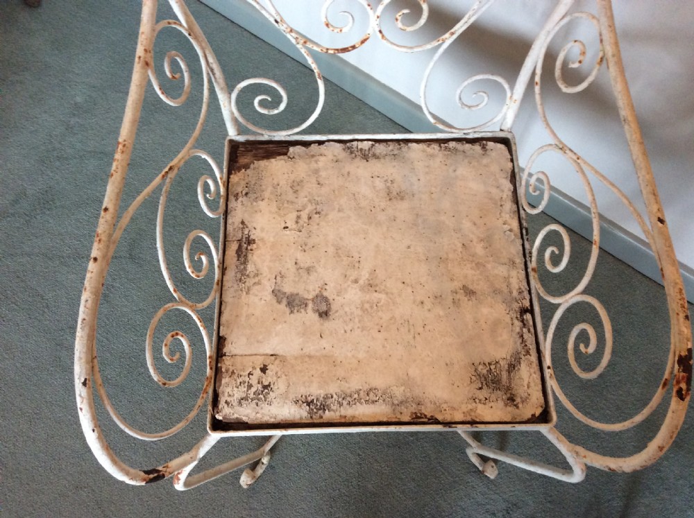 A pair of French iron garden chairs View V