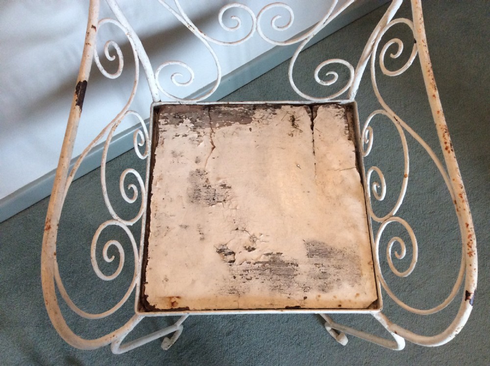 A pair of French iron garden chairs View VI