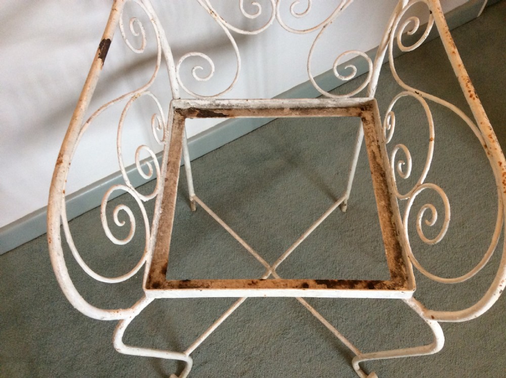 A pair of French iron garden chairs View VII