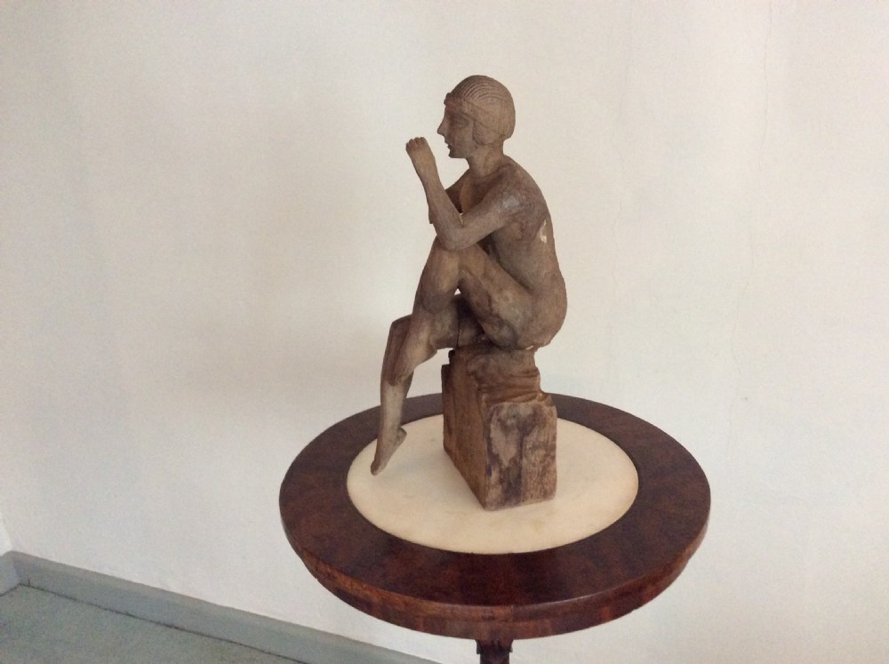 A carved wood Deco period sculpture