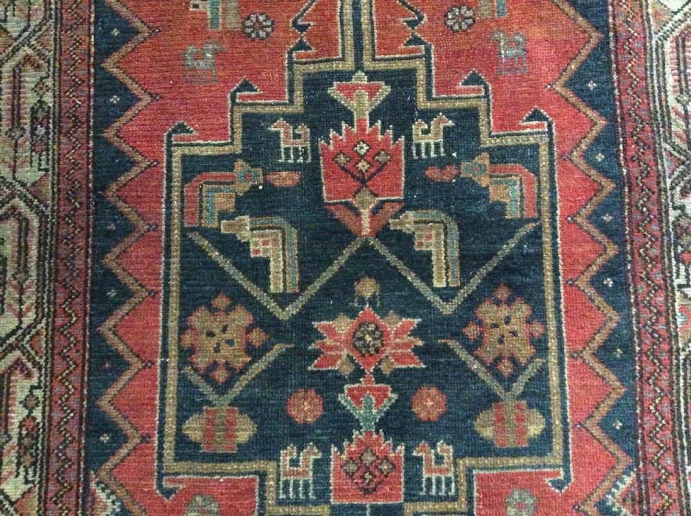 A 2m long handmade antique rug View II