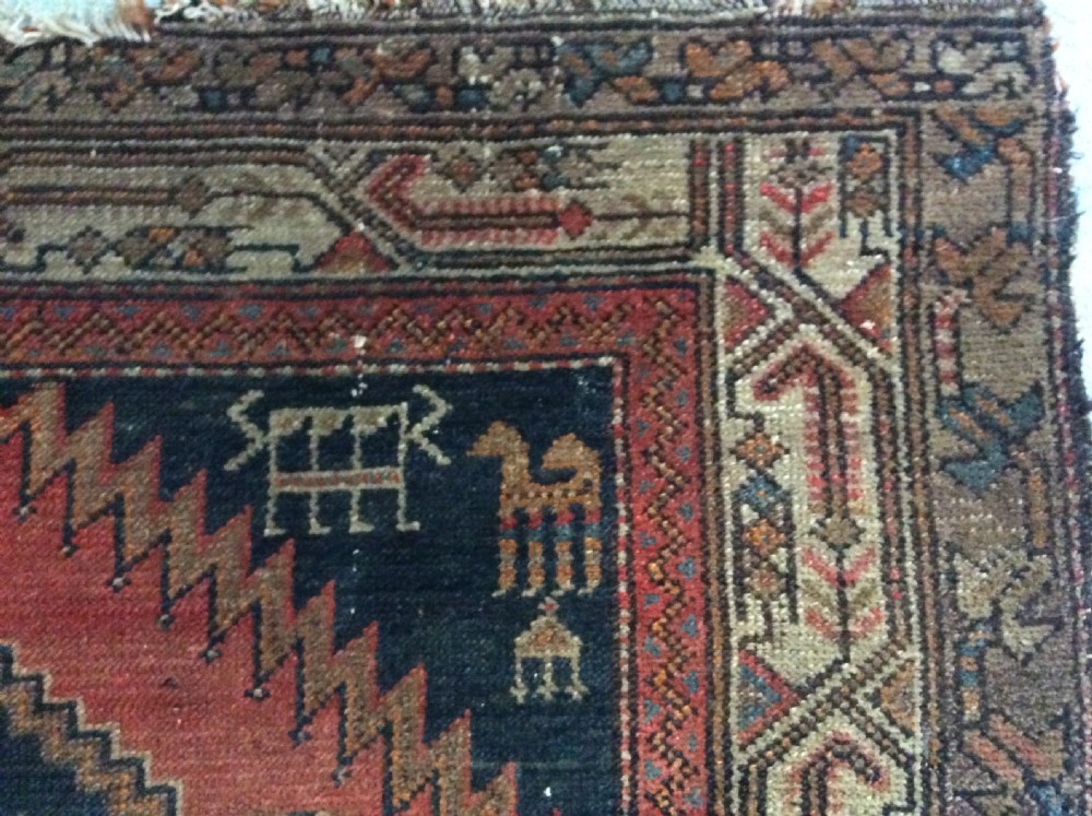 A 2m long handmade antique rug View III