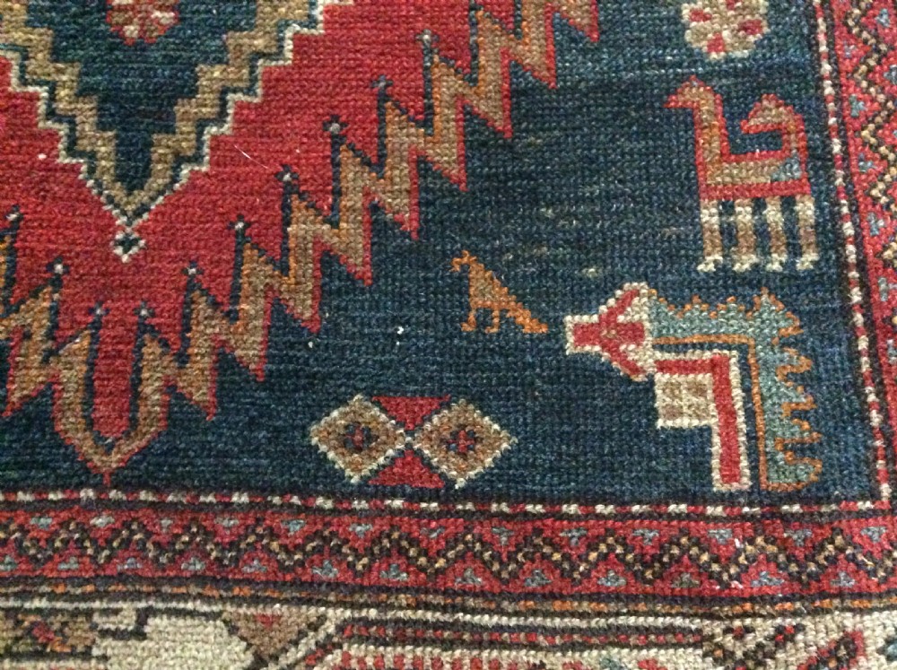 A 2m long handmade antique rug View V