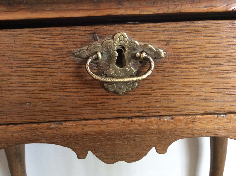 An 18thC oak hoof foot lowboy View II