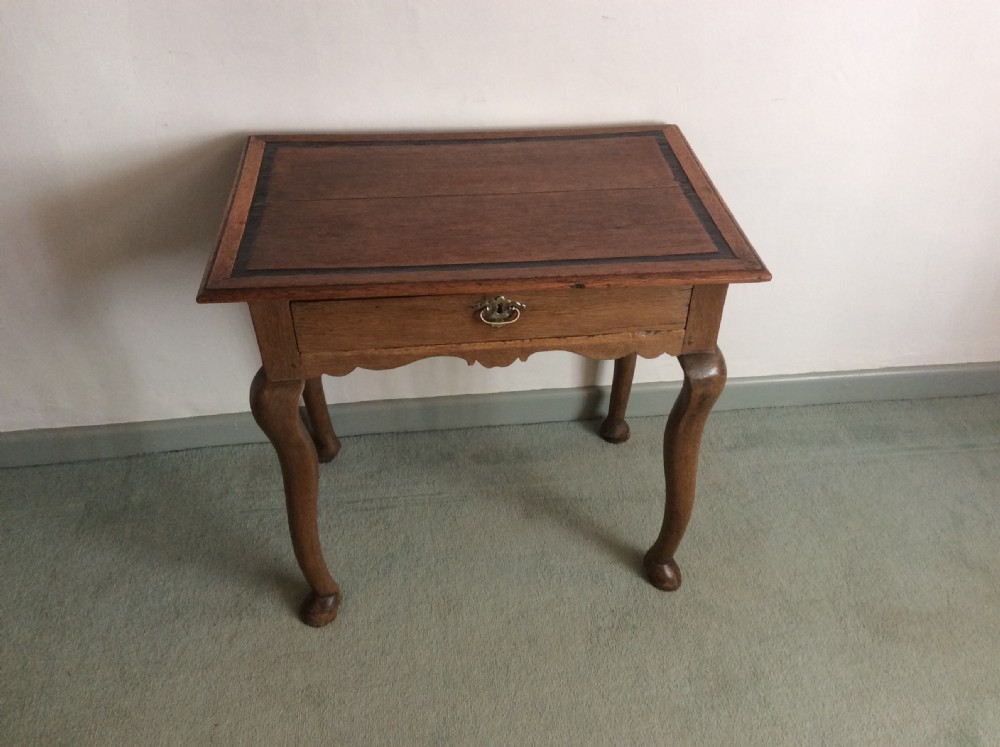 An 18thC oak hoof foot lowboy View VII