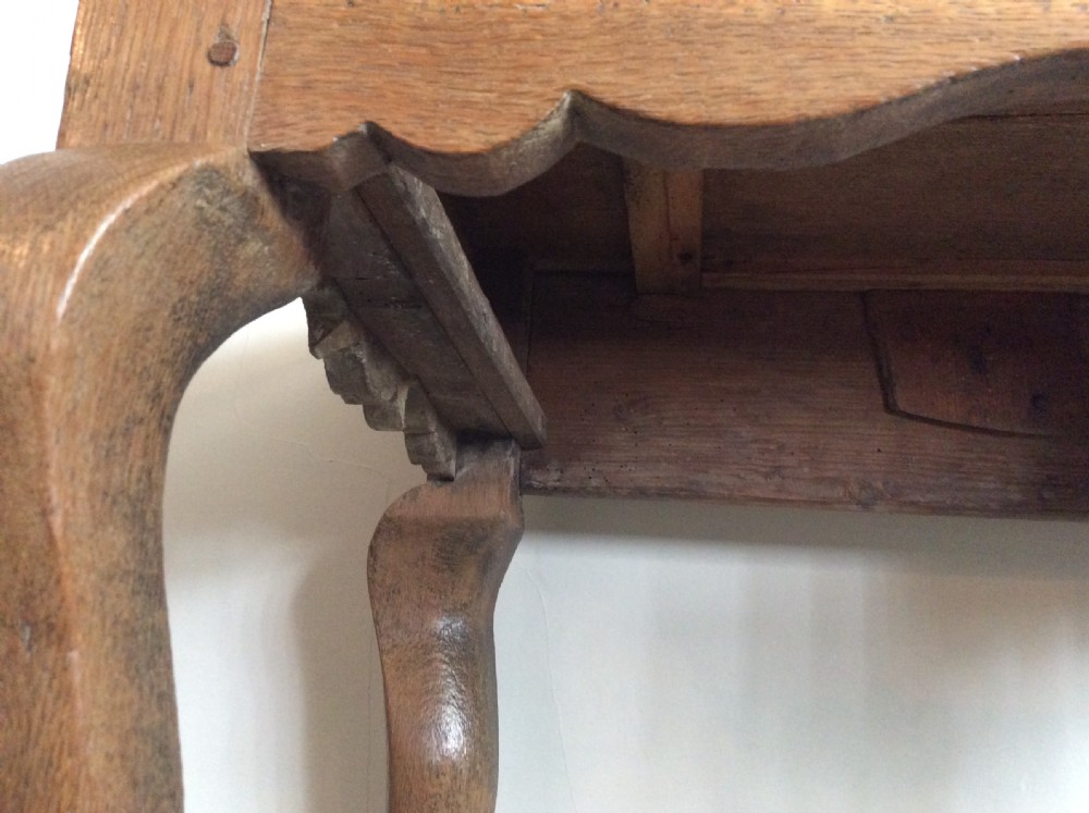 An 18thC oak hoof foot lowboy View IX