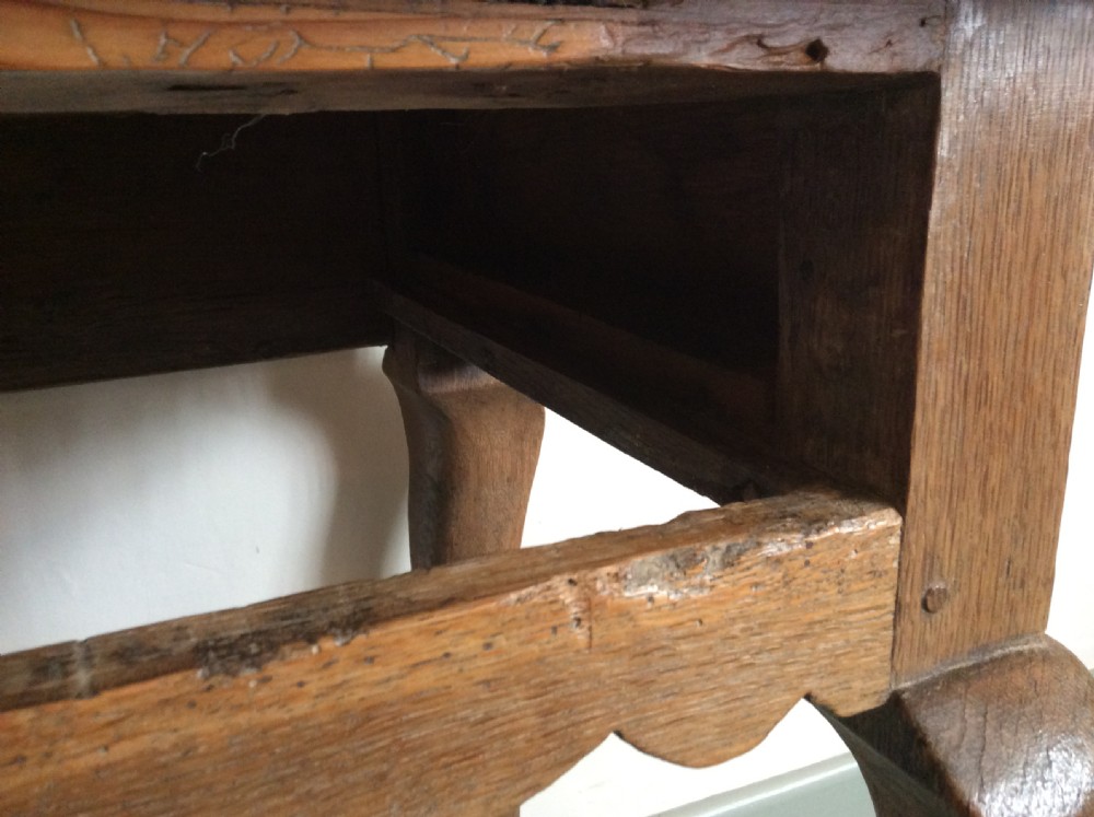 An 18thC oak hoof foot lowboy View X
