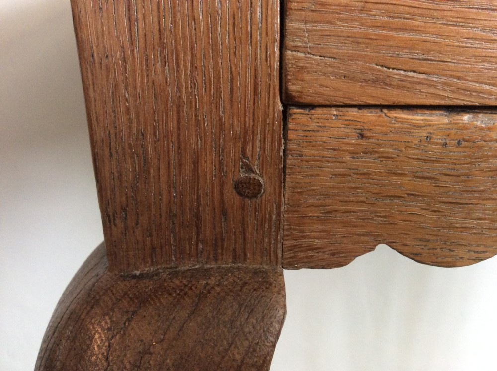 An 18thC oak hoof foot lowboy View XI