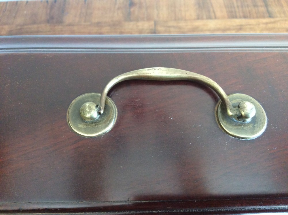 A dark mahogany Georgian tea caddy featuring a stepped lid with a top brass handle and a central brass keyhole escutcheon. View VIII