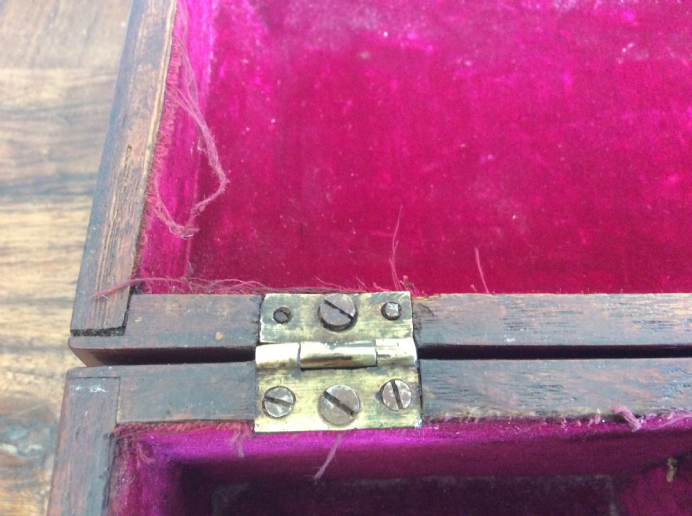 A dark mahogany Georgian tea caddy featuring a stepped lid with a top brass handle and a central brass keyhole escutcheon. View XI