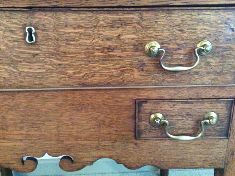 A Georgian oak lowboy View II