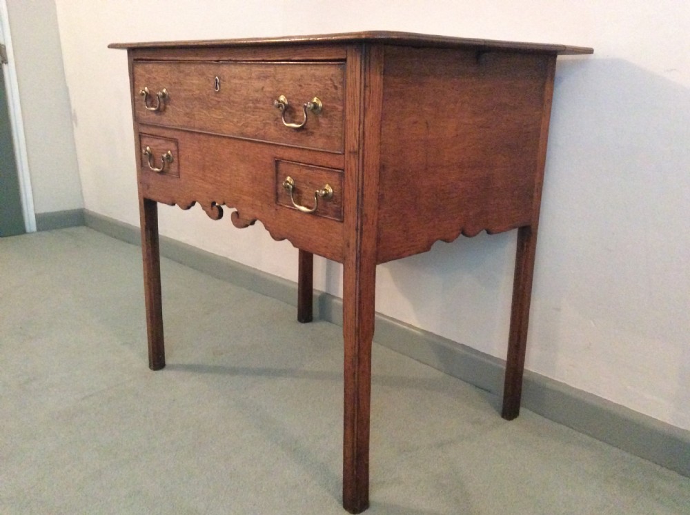 A Georgian oak lowboy View III