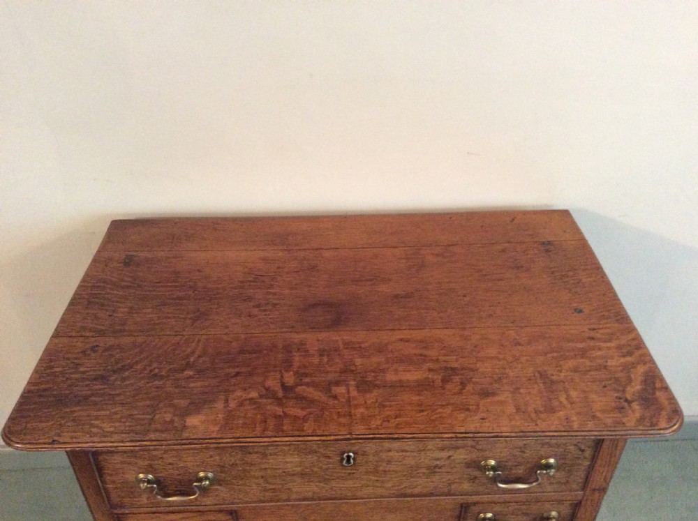 A Georgian oak lowboy View IV