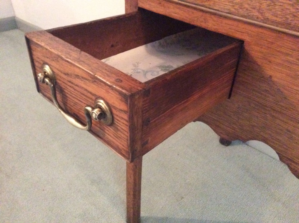 A Georgian oak lowboy View VI