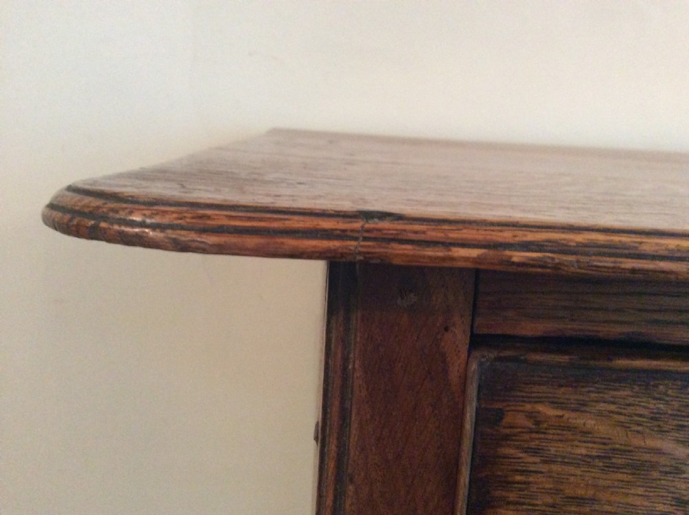 A Georgian oak lowboy View IX