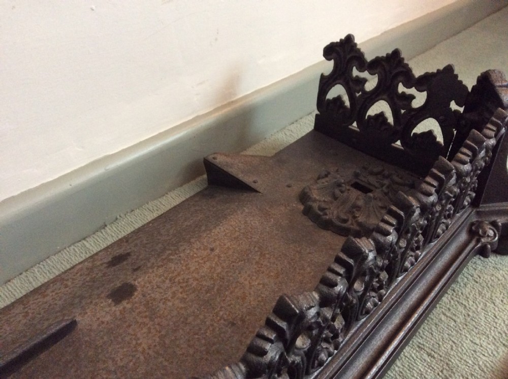 A large ornate Victorian cast iron fender View XV