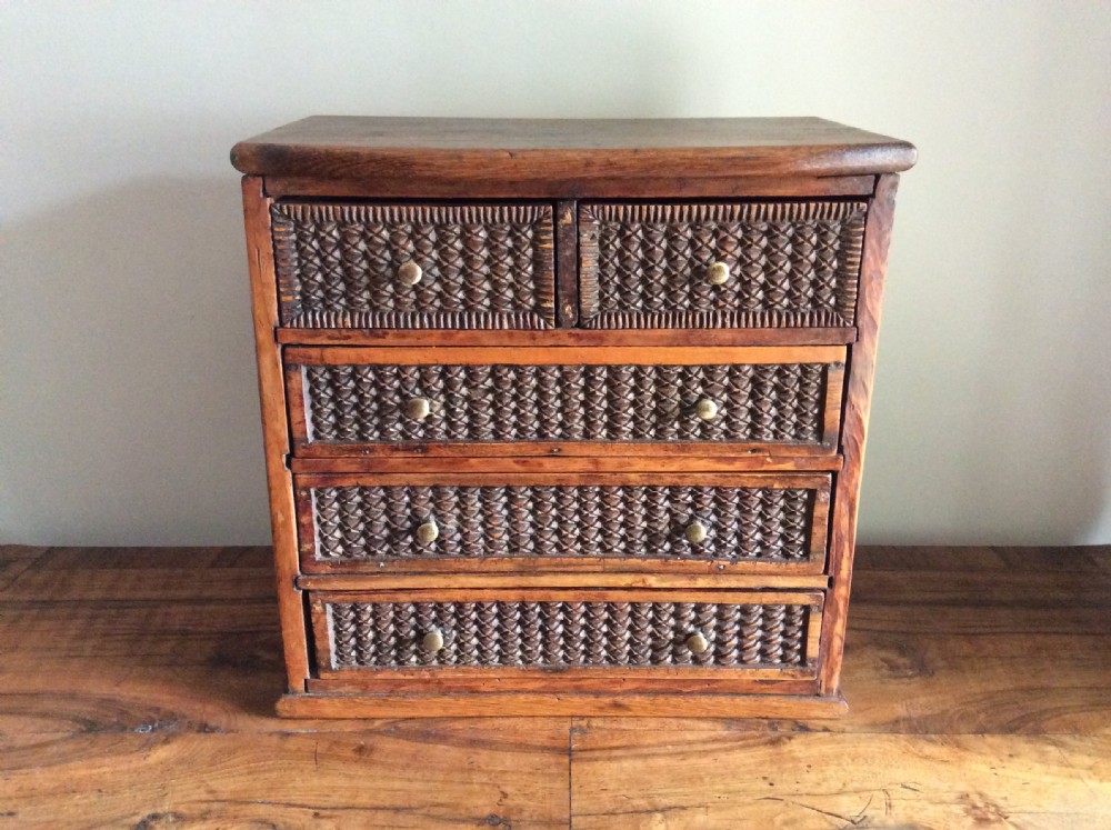 A tramp art miniature chest