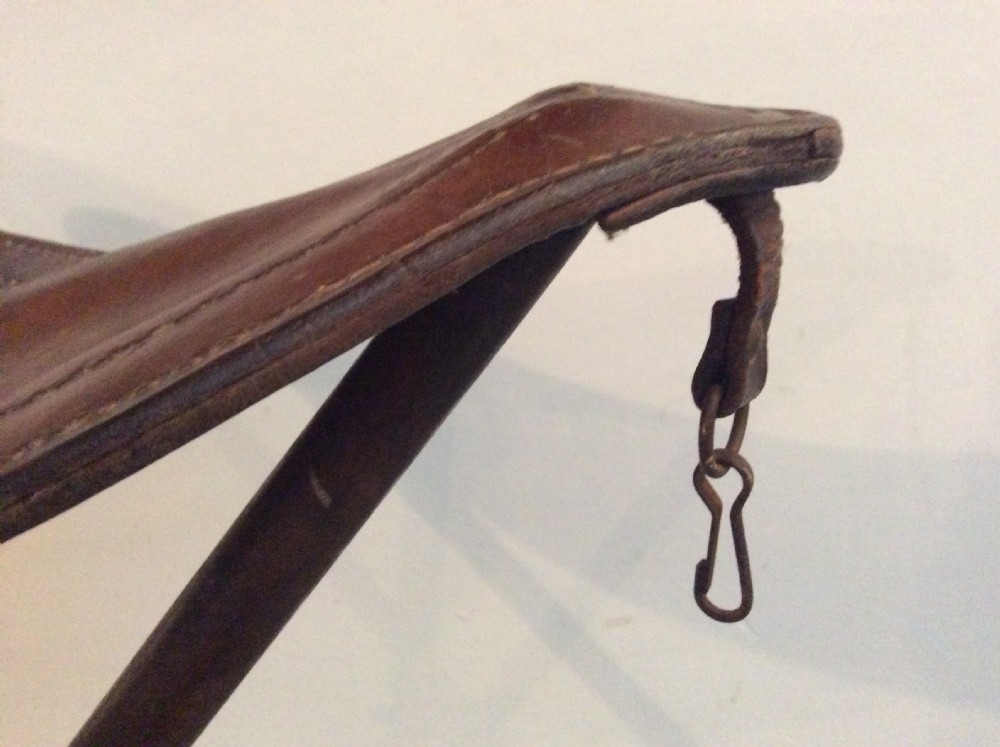 A folding leather campaign stool View V