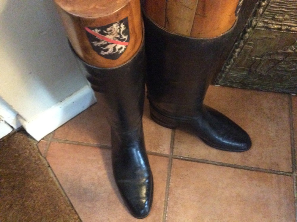 A pair of decorative riding boots View V