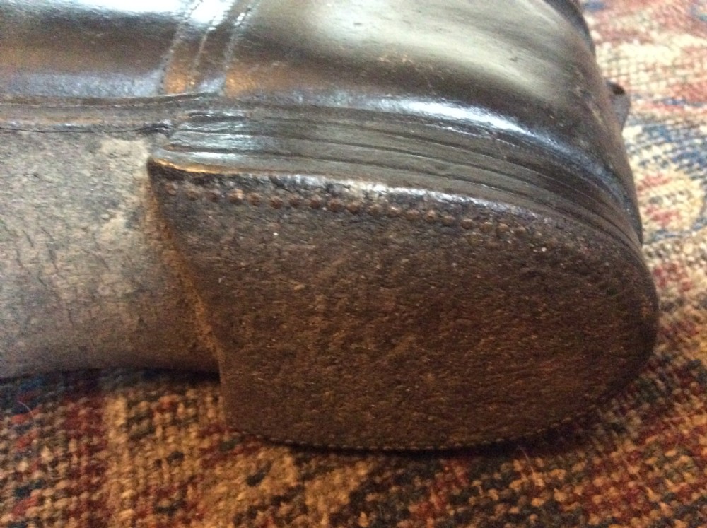 A pair of decorative riding boots View VI