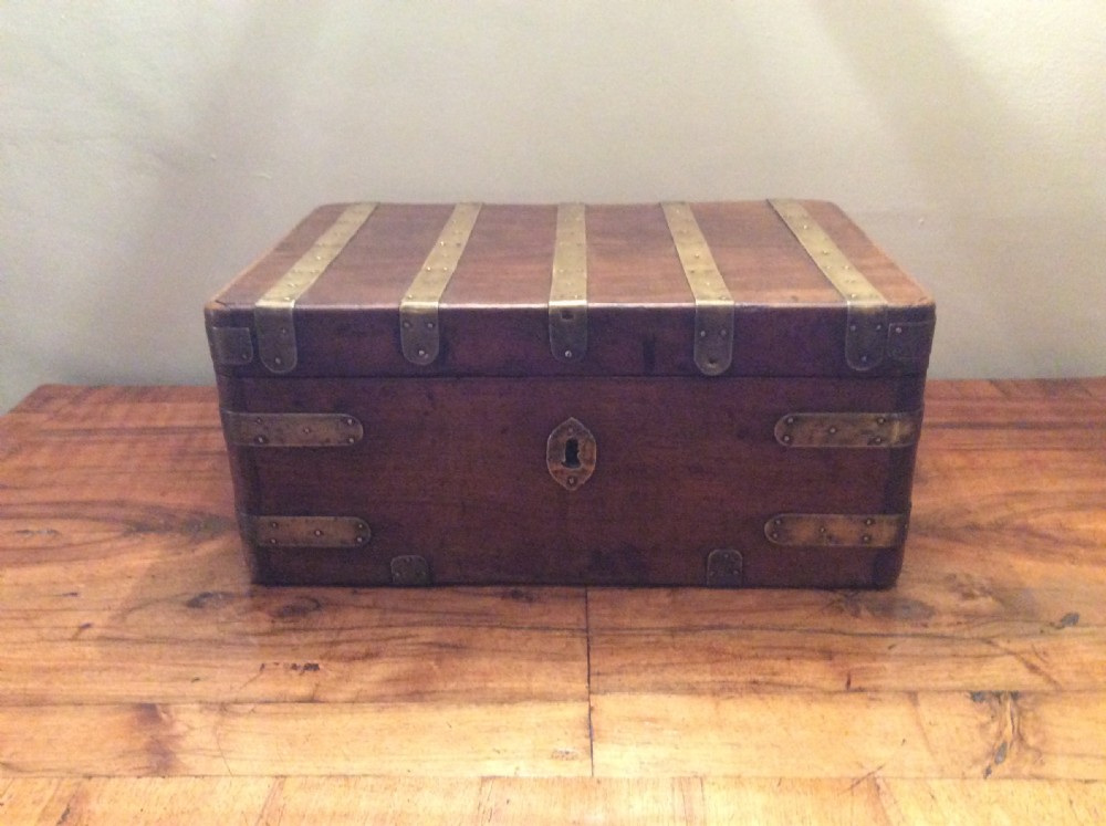 A Colonial camphor wood brass bound strong box