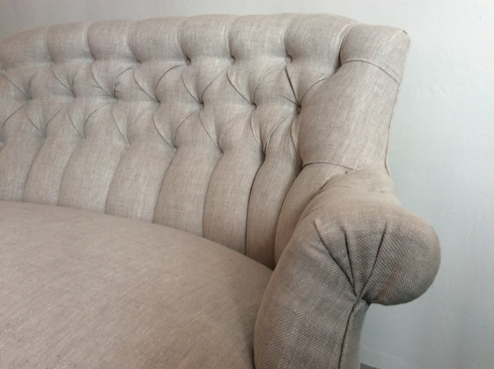 A small buttoned back French sofa View II