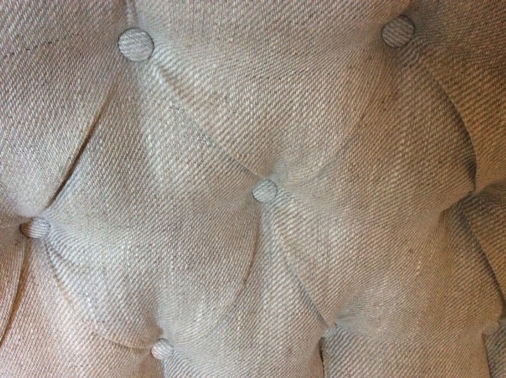 A small buttoned back French sofa View V