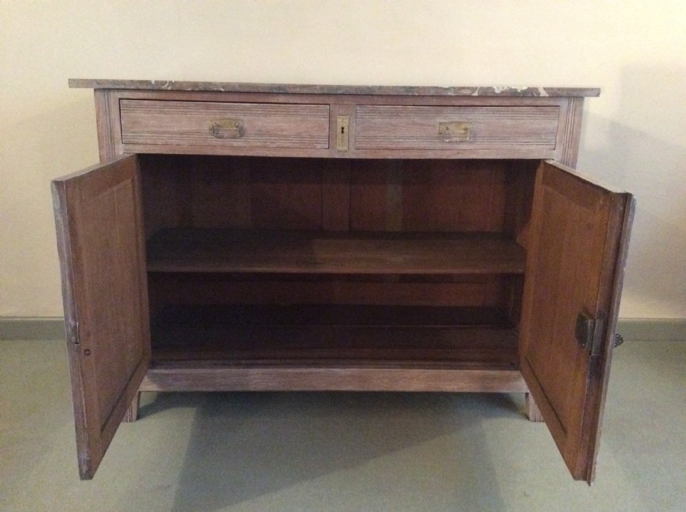 A French limed oak marble top cupboard View II