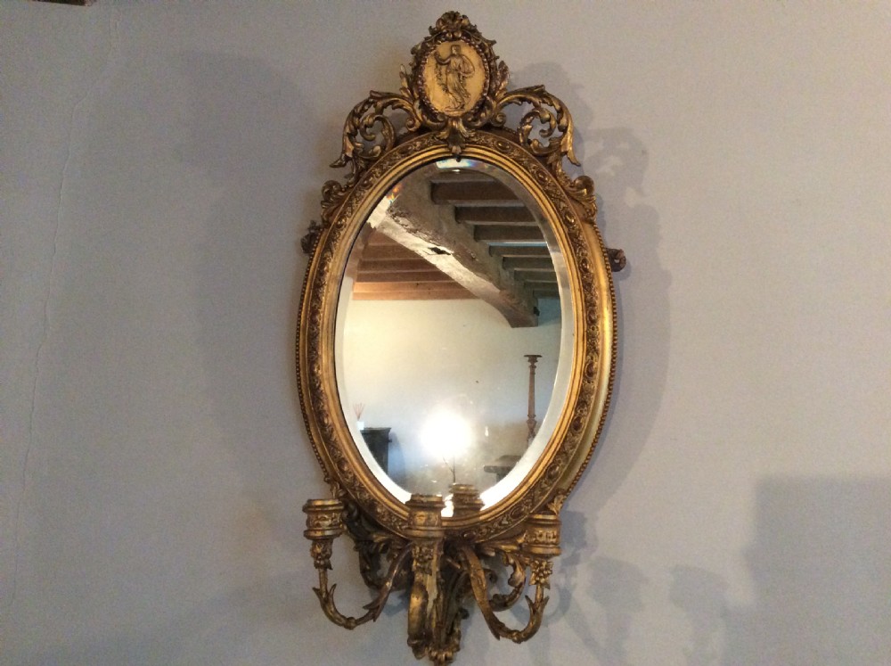 A gilded Victorian girondole mirror
