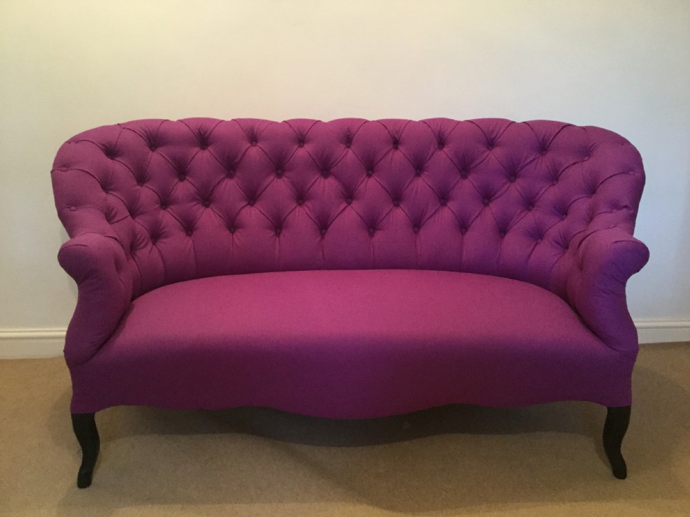 A 19thC English button back sofa