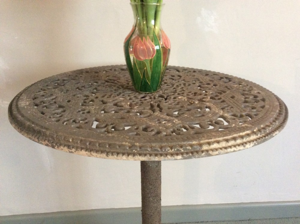 A cast metal and iron garden table View III