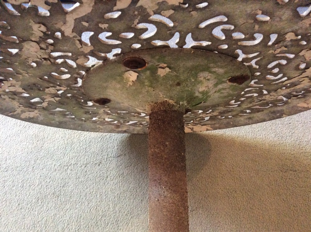 A cast metal and iron garden table View V