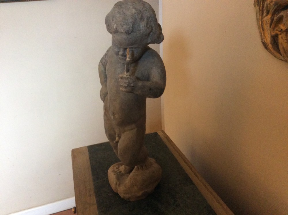 A small late 19thC lead cherub garden feature View VI
