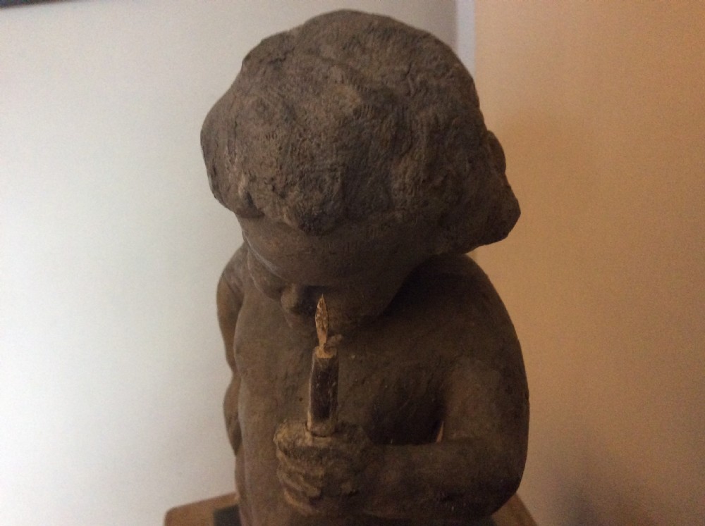 A small late 19thC lead cherub garden feature View VII