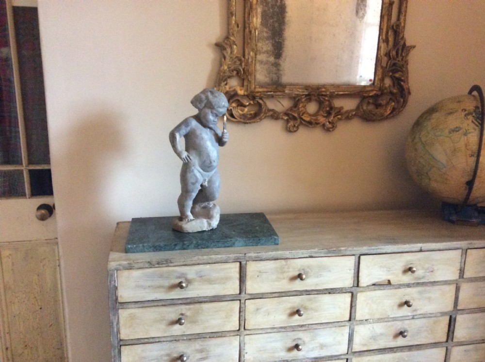 A small late 19thC lead cherub garden feature View IX