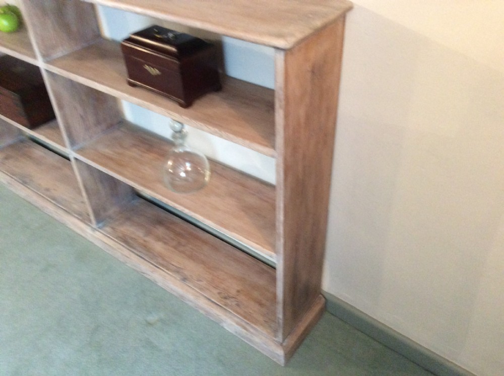 A limed pine double open bookcase View VII
